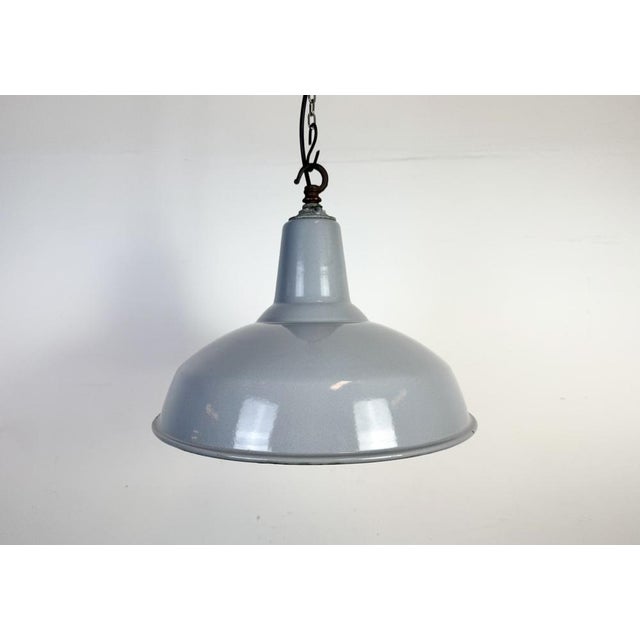 Industrial grey enamel factory pendant light made in united kingdom during the 1960s. White enamel inside the shade. Iron...