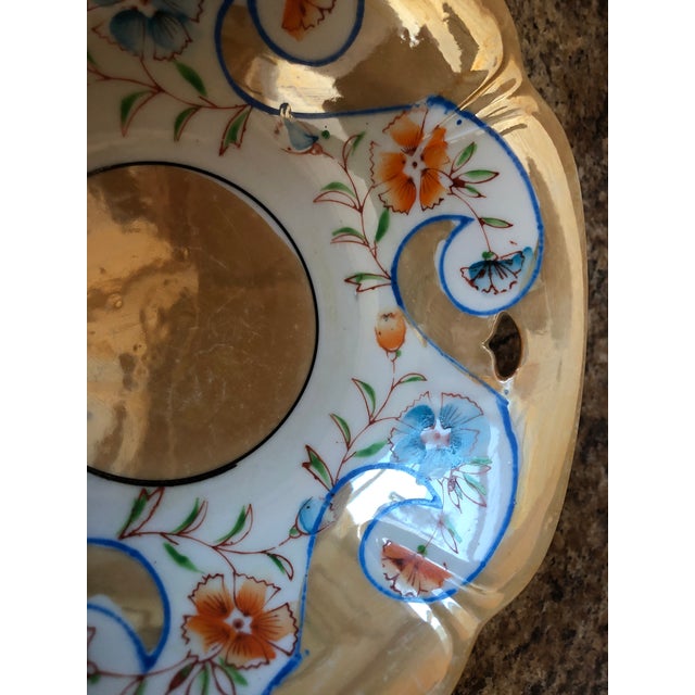 I just love the colors and luster of this bowl. Delicate blue and orange flowers. Marked made in Japan.