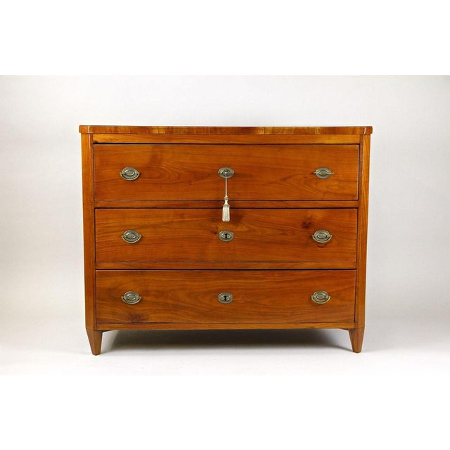 Fantastic looking 19th century cherrywood chest of drawers from the early Biedermeier period around 1830 in Austria. This...