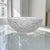 This Lalique France Pinsons crystal centerpiece bowl was produced in Wingen-sur-Moder, France during the Mid 20th Century,...