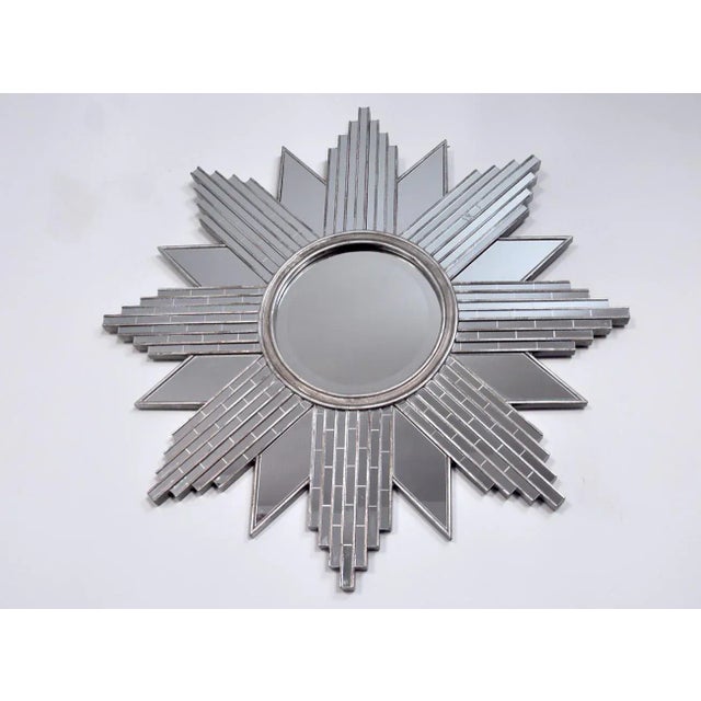 Stunning and large Art Deco sun mirror composed of cut and engraved crystals dating from the 70s. This unique mirror will...