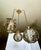An exceptional mid-century modern three-light cluster chandelier, heavily influenced by the glamour of the Hollywood...