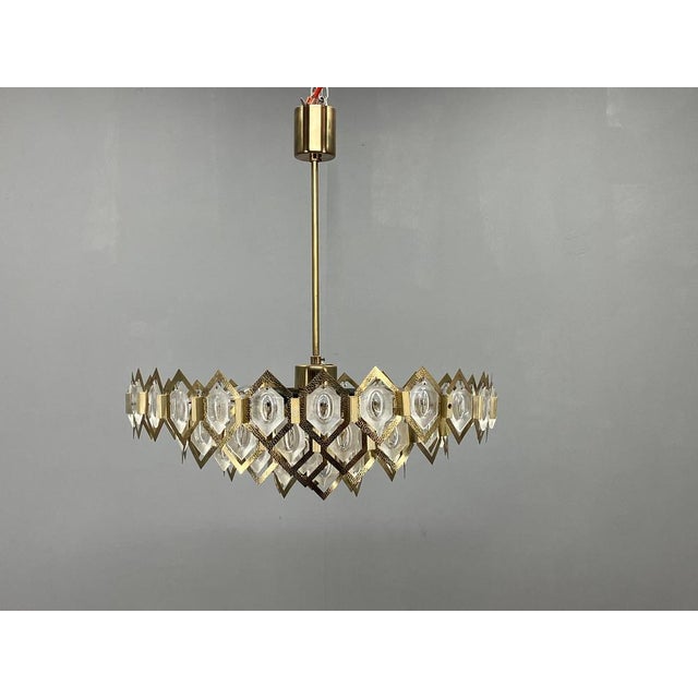Rare 1960s faceted glass and brass chandelier by czech designer jaroslav bejvl, manufactured at the prestigious kamenický...