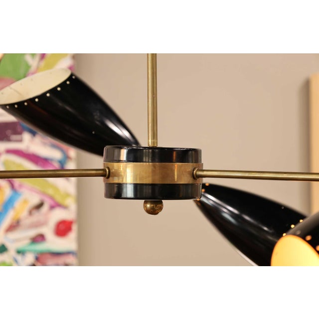 Elevate your interior aesthetics with the Stillnovo Style Chandelier, meticulously crafted to embody the essence of mid-...