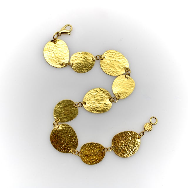 This 24k gold bracelet is part of the Gurhan Lush Collection. It consists of oblong hand-hammered discs that vary in shape...