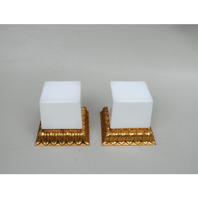 A pair of delicate, unique ceiling lights, manufactured by limburg in germany in the 1970s. The combination of gold and...