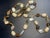 This mid-century Bohemian glass necklace features an alternating sequence off-white to cream-colored translucent...