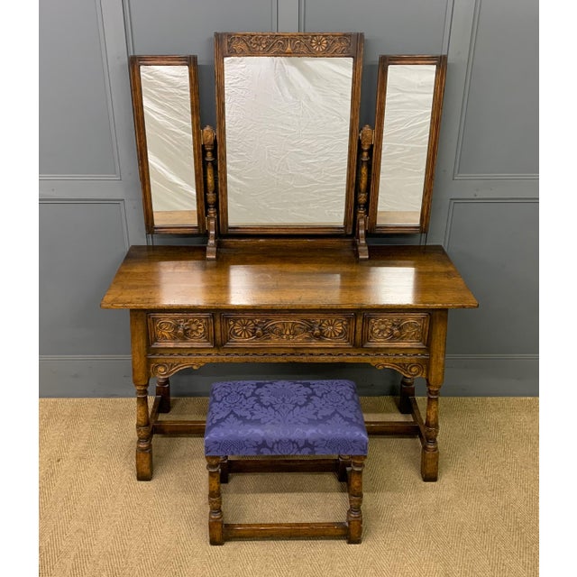 A charming Ipswich oak dressing table and matching stool by Titchmarsh and Goodwin of Ipswich. Very well constructed in...