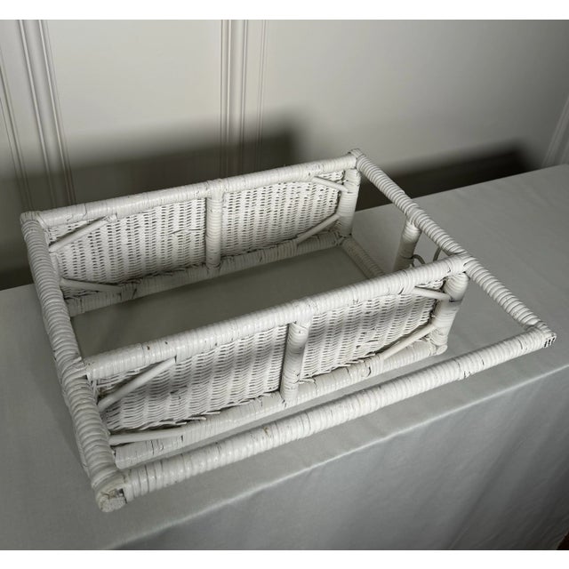 This vintage case good unit consists of white wicker with two shelves and towel bar. This would make a great addition to...