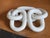 Alabaster chain of five interlocking oval links carved from a single block, the surfaces polished smooth with subtle grey...