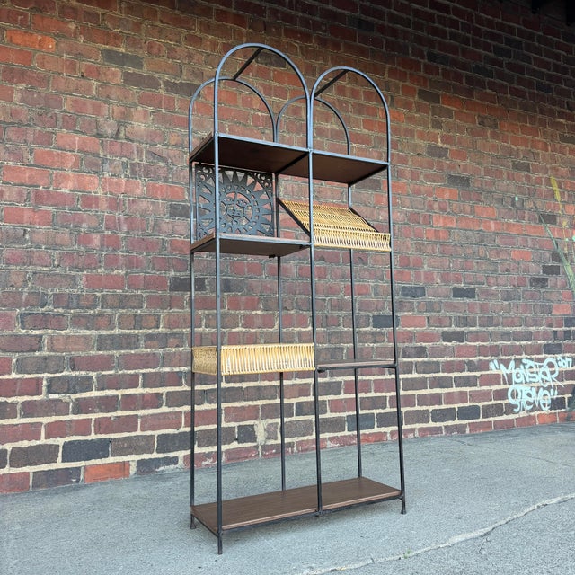 Ready to add whimsy and mid-century charm to any space, this Arthur Umanoff Etagere has 6 unique caning and faux wood...