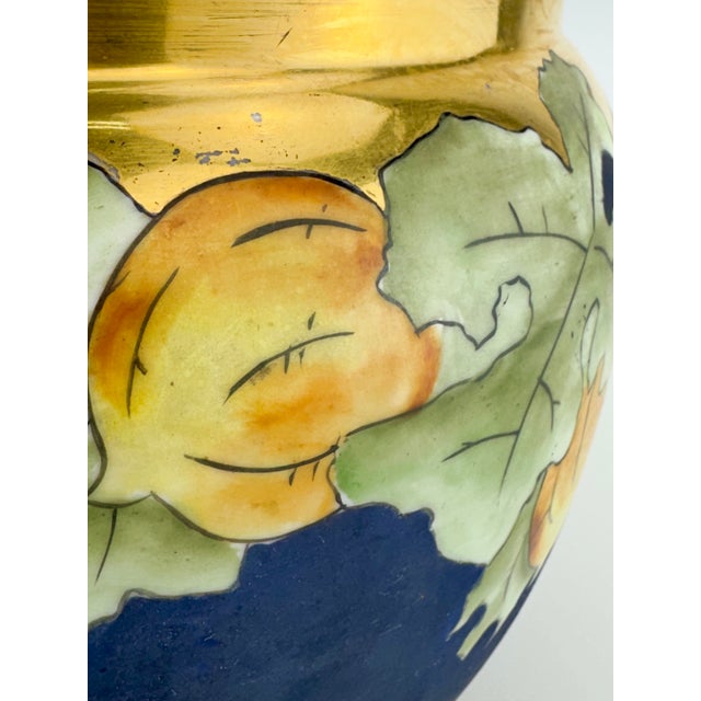 A striking antique porcelain jardinière by O. & E.G. Royal Austria, dating to the early 20th century. The rounded form...