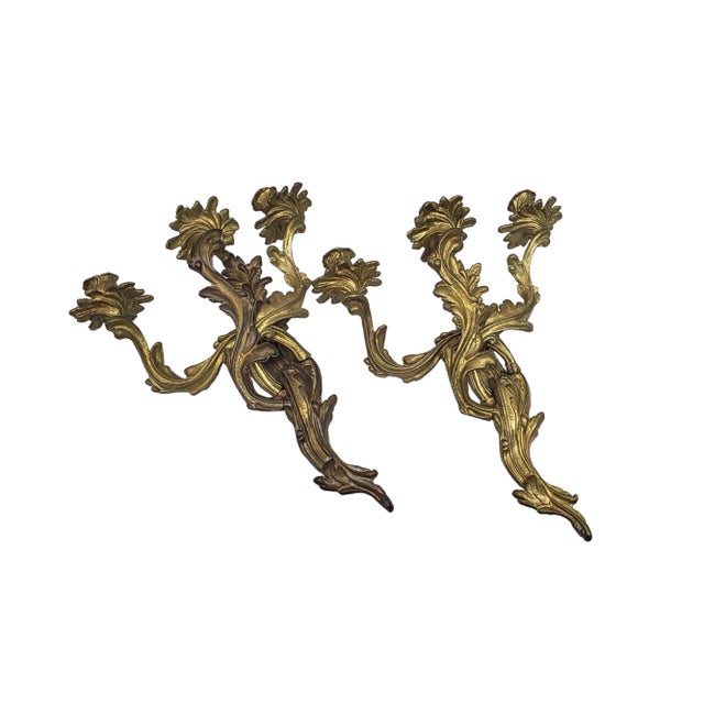 A pair of bronze wall sconces, crafted in the Louis XV manner by Glo-Mar Art Works of New York.