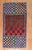 A handmade one of a kind American Hooked Rug from the 3rd quarter of the 20th century with an irregular checkerboard...
