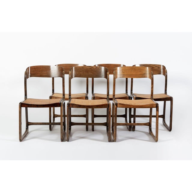 This set of six vintage mid century French modern "Traineau" (Sled) side chairs designed by Emile & Walter Baumann for...