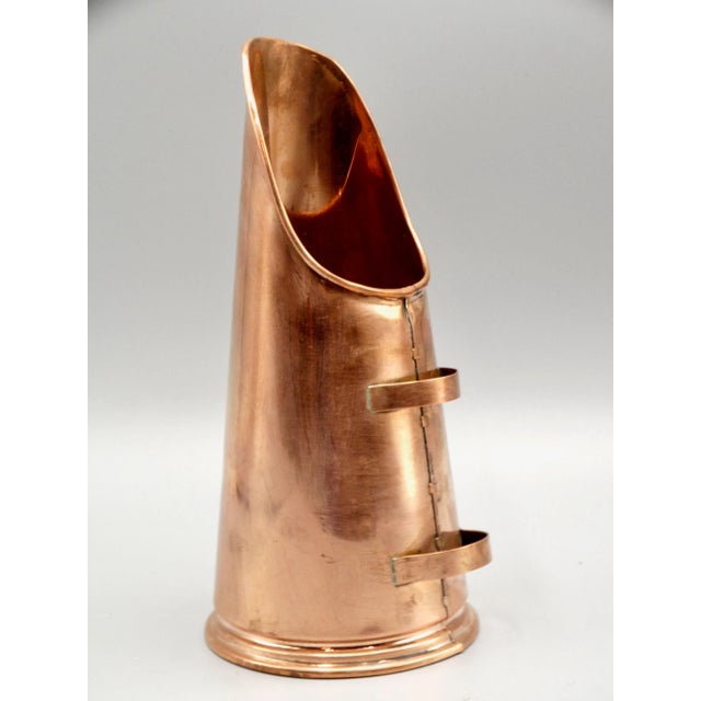 A novelty miniature collectible English copper coal scuttle. This lovely collectible early 20th-Century scuttle is...