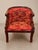 Striking early 20th century carved mahogany barrel chair featuring dramatic sculptural swan-form arms, layered feather...
