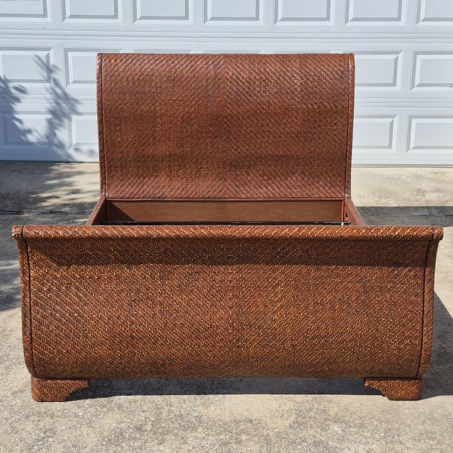 This is a wonderful British colonial style wicker sleigh bed frame that fits a queen size mattress. The bed is unsigned,...