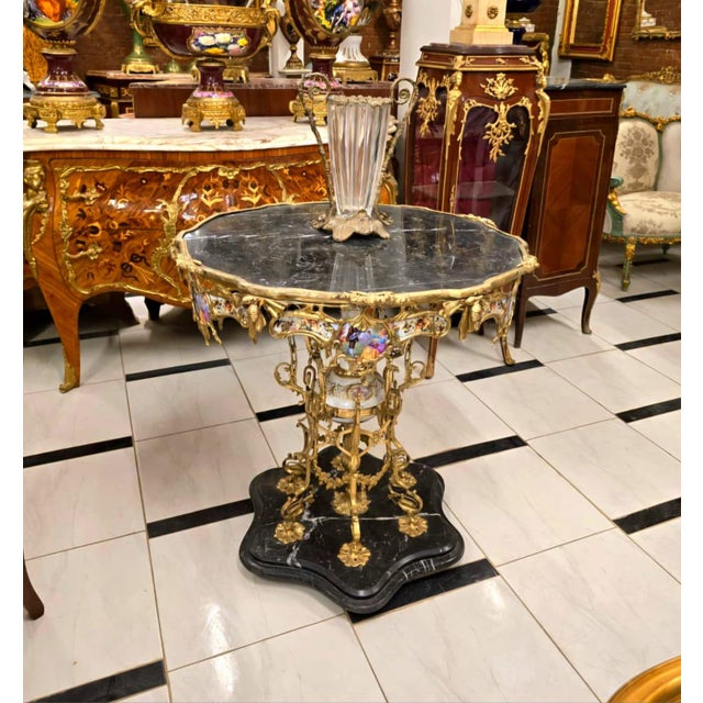 Make a dramatic statement with this extraordinary French Baroque coffee table, featuring a stunning round glass top...