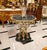 Make a dramatic statement with this extraordinary French Baroque coffee table, featuring a stunning round glass top...