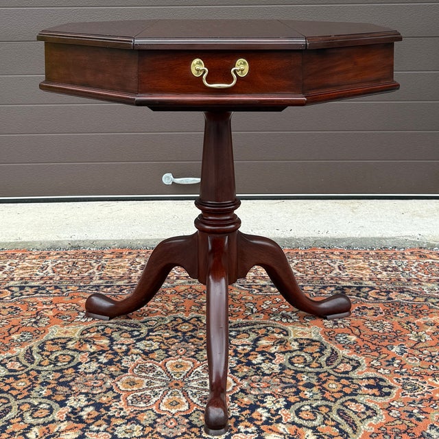 A vintage Henkel Harris Traditional Queen Anne solid mahogany octagonal side table having two storage compartments over a...