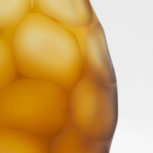 This hand-blown Murano Battuto Oval Vase in Amber is a magnificent expression of Venetian artistry, designed to captivate...