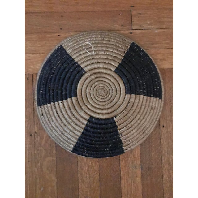 Beautiful round hand-made African woven basket blue and brown. Decorative and functional. Good condition. Acquired at an...