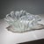 Glass bowl with a waved rim formed as a stylized flower. Its organic design and elegantly sculpted silhouette give the...