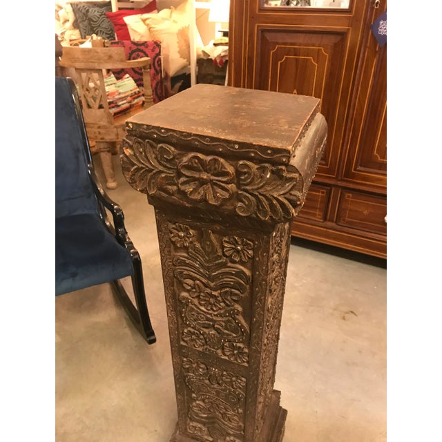 Hand-made hand-carved wood pillar or pedestal with applied metal detail. The carved designs are fantastic and the...