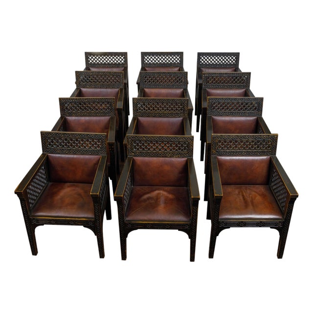 Set of 12 Moroccan Ebonized Carved Wood Armchairs with Leather Seats, circa 1900 For Sale