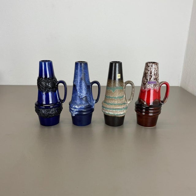 These original vintage vases was produced in the 1970s in Germany. It is made of ceramic pottery in fat lava optic. Super...