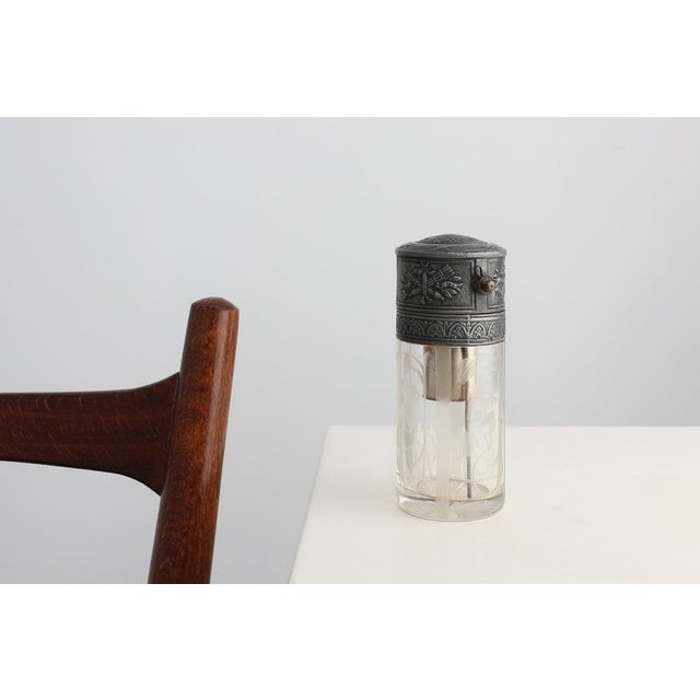 A refined Art Nouveau perfume atomizer by Val Saint‑Lambert, Belgium, dating from the early 20th century. This exquisite...