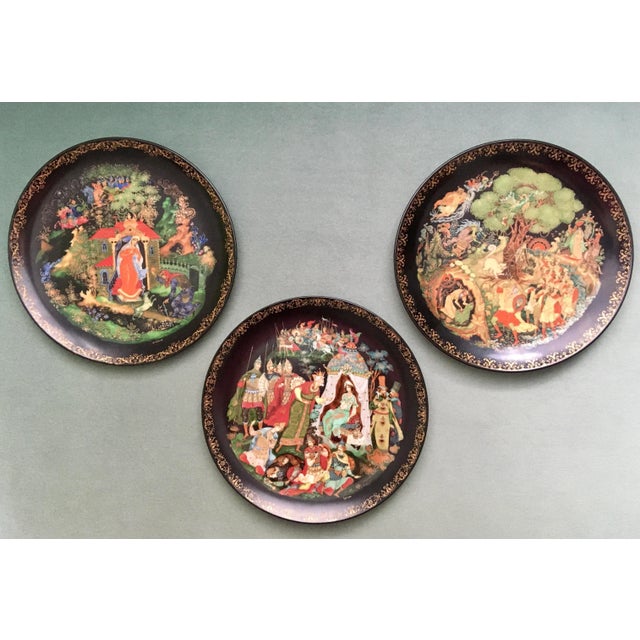 A fascinating set of three colorful decorative plates done in the Palekh style by Alexander Kovalev based on traditional...