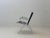 A rare french lounge chair by andré monpoix from the 1950s, featuring a striking, graphic design and a delicate metal...