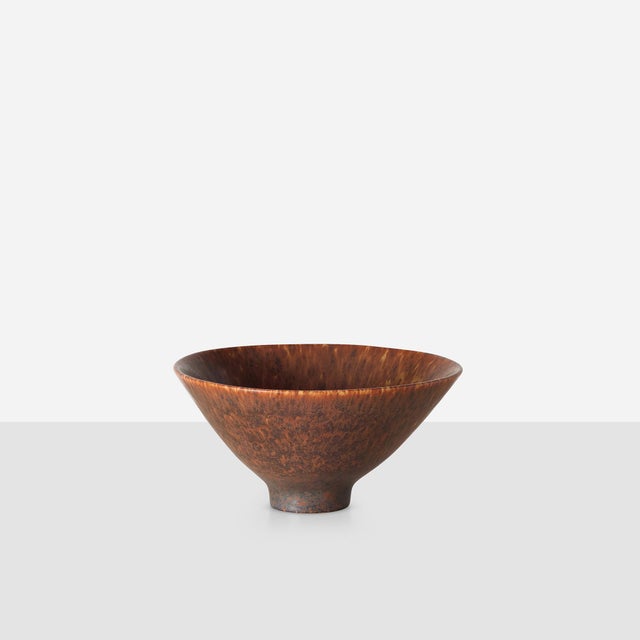 Conical bowl with hare's fur glaze in brown and red tones. Model SHX. Signed CHS with Rörstrand studio marking on base.