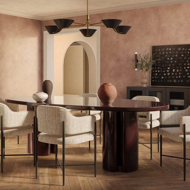 The Zola Burgundy Lacquer Dining Table makes a bold statement with its rich burgundy lacquer finish and sleek, modern...