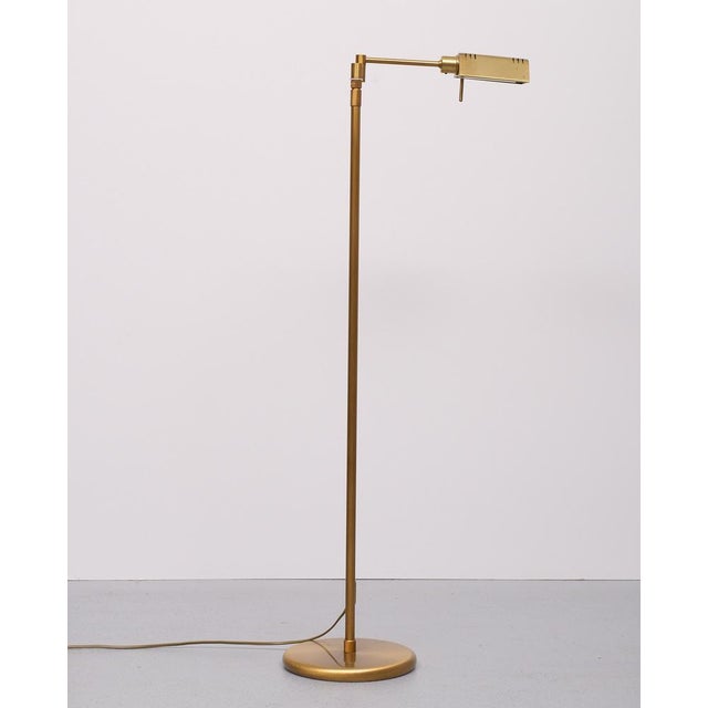 Lovely Brass Bronze Floor lamp Adjustable in Height and turn able .Swing Arm . Halogen ,comes with a good working dimmer ....