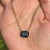 This elegant 5.2 carat cushion cut blue sapphire pendant necklace is crafted in 14K yellow gold. The sapphire measureing...