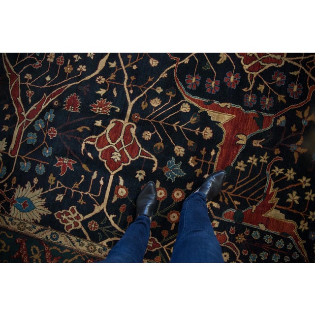 :: Covered field in a classic antique Bijar design motif with suggested shadow center medallions in faint detailed...