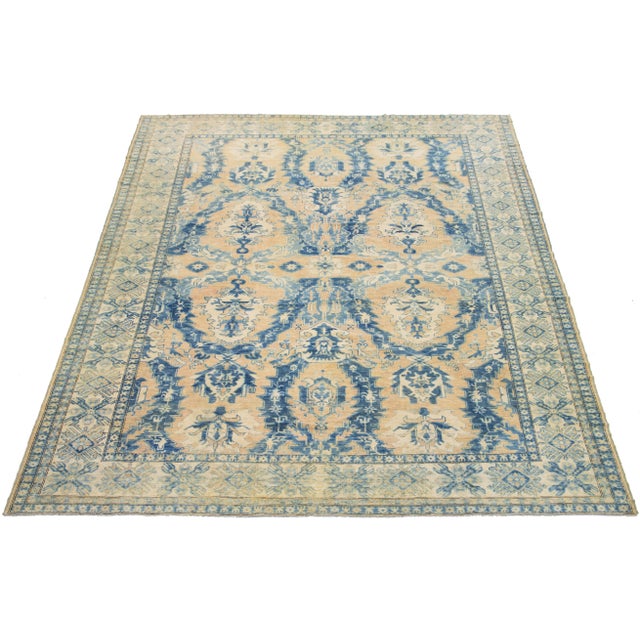 This mid-century wool rug showcases a stunning allover design inspired by traditional Islamic patterns. With a rich tan-...