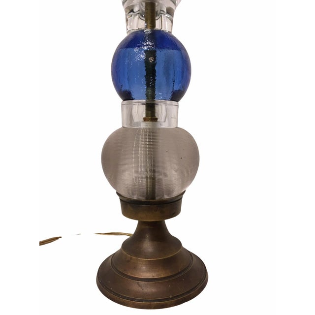 Vintage glass table lamp. This folk art piece is one of a kind being made by an amateur artisan and features several...