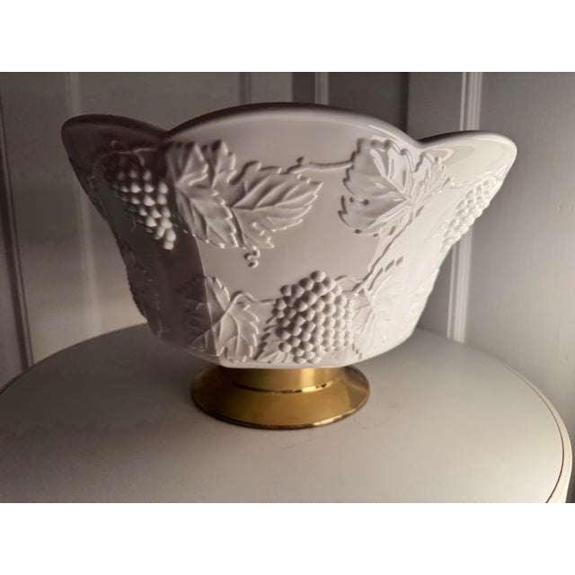 Gorgeous vintage milk-glass punch bowl with grape and leaves "harvest" motif emblematic of the 1950's. Glass is pearly...