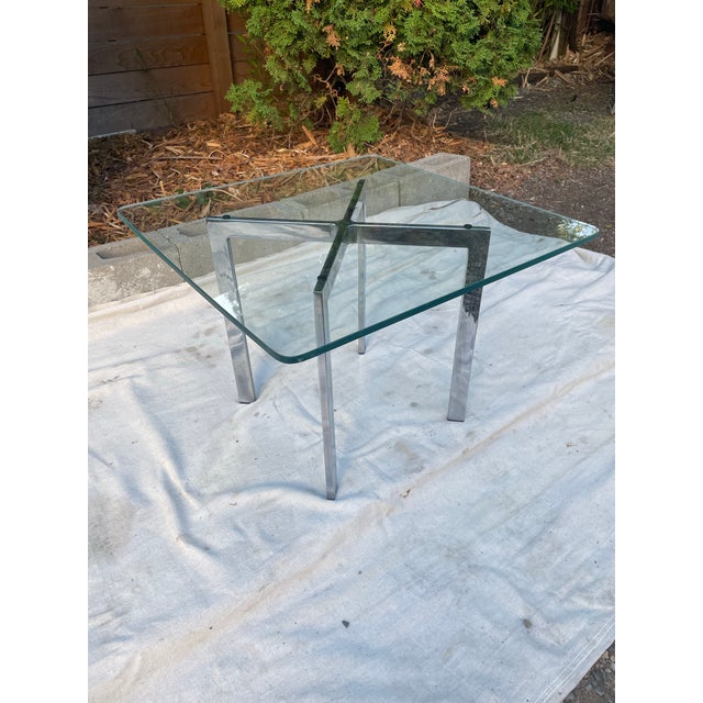 Vintage Barcelona-style side table in the manner of Mies van der Rohe's iconic design, featuring a brushed...