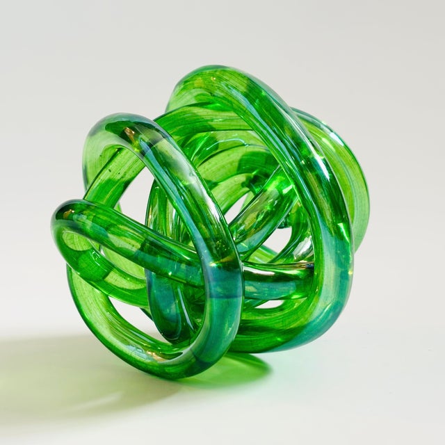 A beautiful vintage art glass knot. Vibrant green color to the glass. A great sculptural accent piece. Measures 5"W x...