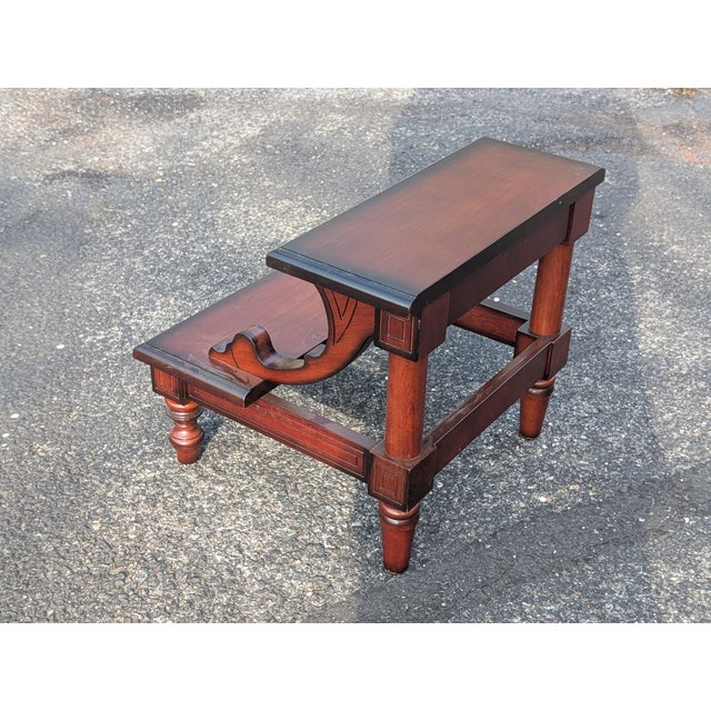 This vintage wooden step stool brings a touch of classic library elegance and practical utility to any room in your home....