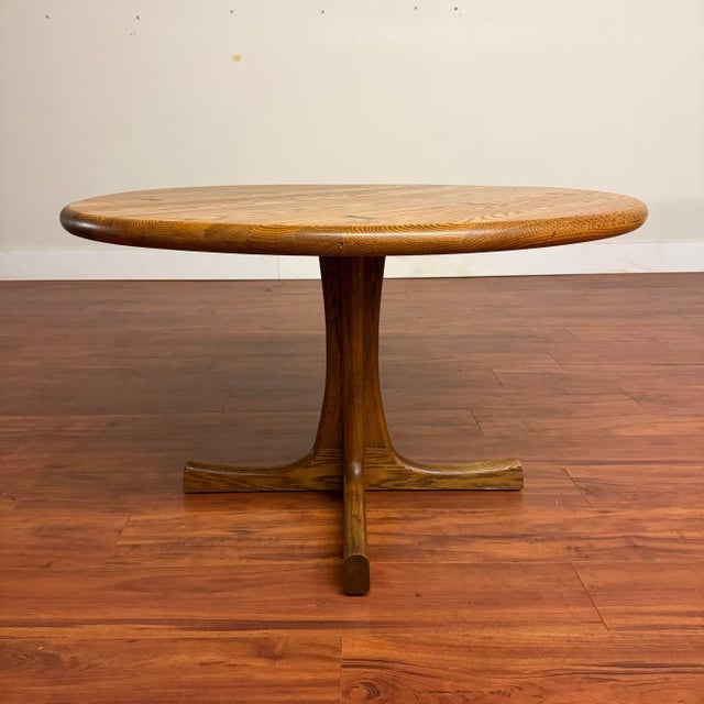 Vintage solid oak dining table with pedestal base and faux butterfly joints with beautifully refinished top, ready for a...