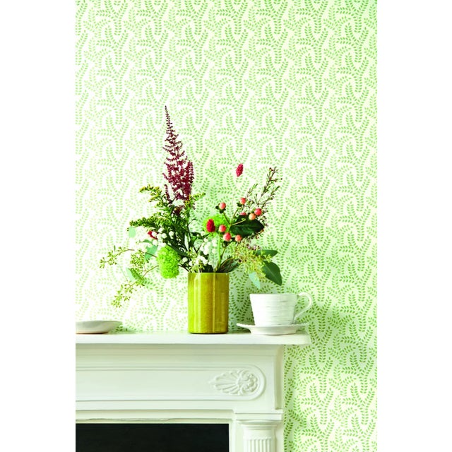 This small-scale stylised leaf wallpaper displays a subtle colour variation across each cheerful sprig. Fresh and...