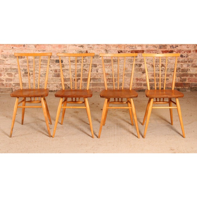 This collection includes four Ercol model 391 chairs crafted from elm and beech wood, dating back to the 1960s. They are...