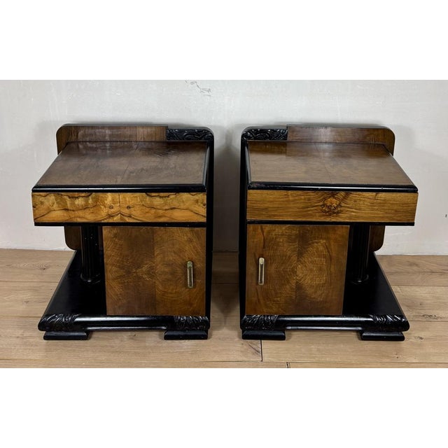 Striking pair of Art Deco nightstands featuring a bold architectural design with integrated column details and a strong...