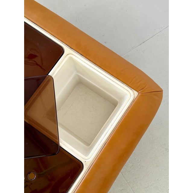Effortlessly cool and endlessly useful, this Nuvolone coffee table hides four storage compartments behind a newly...